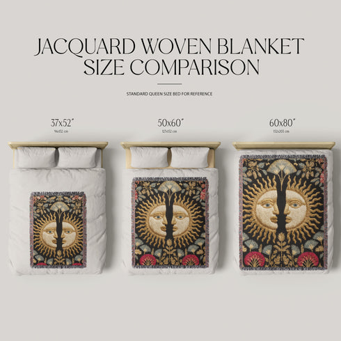 Jacquard-woven cotton blanket featuring twin celestial suns—two serene faces meeting at center—with radiant golden rays on a charcoal ground, bordered by folkloric botanicals and fan blossoms in sage, sky, and garnet. Crafted from 100% soft cotton yarn; the artwork is woven, not printed. Reversible with a color-negative back and finished with a protective 2-inch multicolor fringe. Sizes: 52×37, 50×60, 60×80 for wall, sofa, or queen-bed layering.